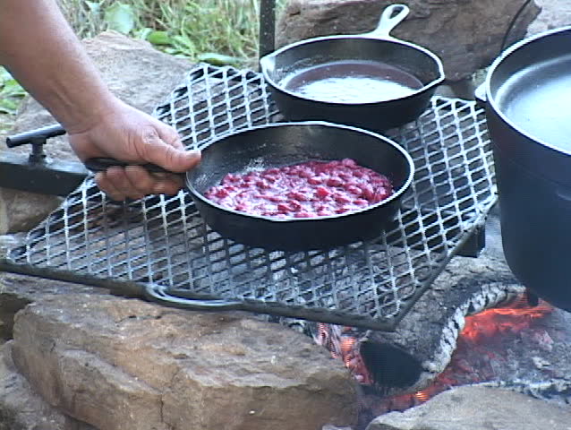 Strawberries cooking in a cast iron skillet