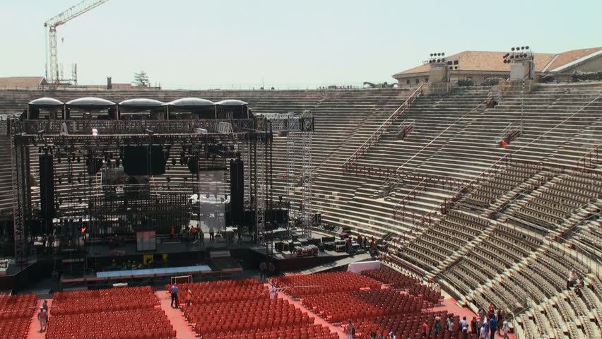 VERONA, ITALY - MAY 10:  Worksmen assembling a stage at the arena of Verona on May 10, 2012 for a concert by Tiziano Ferro. It is the second largest roman amphitheatre in the world and still in use.