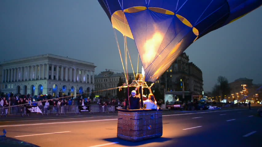 KIEV - OCT 20: Free Games Challenges extremal sport festival opening on October 20, 2012 in Kiev, Ukraine. Operator of air balloon open the gas-stove burner before it start flying.