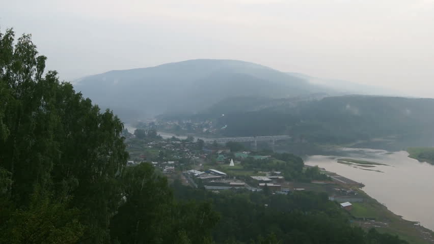 Panoramic view on the river Yenisei, covered by haze of forest fires (01). Russia, Siberia, near village of Ust-Mana (Divnogorsk, Krasnoyarsk territory), summer evening of August 2012.