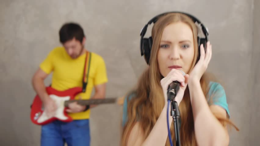 Musician rock band recording song in studio