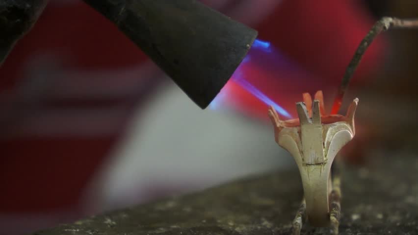 Close up of the making of a Malaysia traditional ring using a fire burner