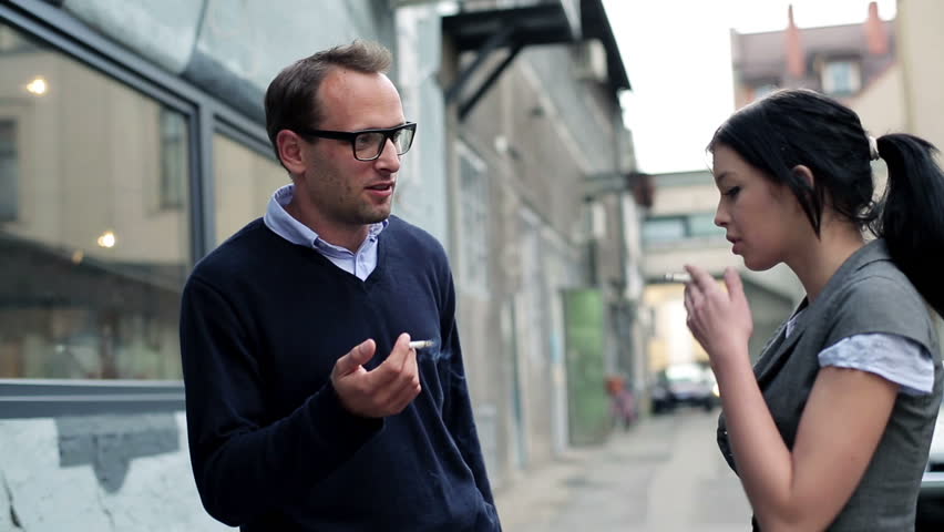Young business people during cigarette break
