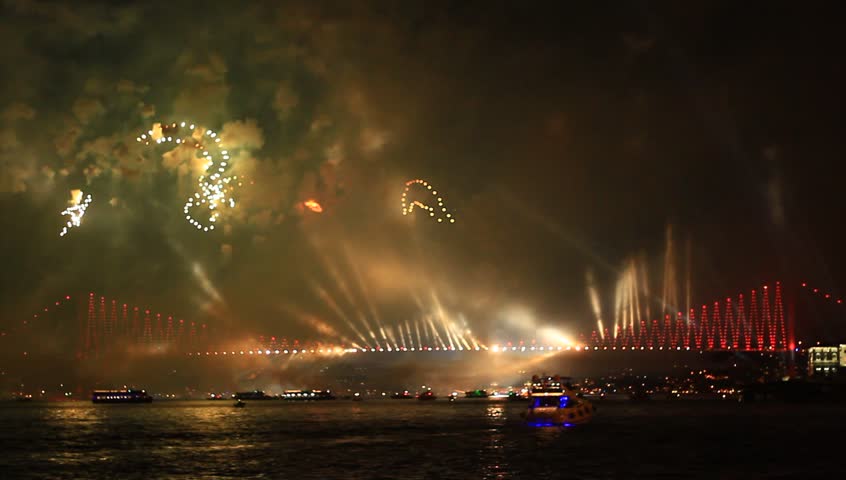 Fireworks over the Bosporus Bridge in Istanbul, Turkey. View of the star and crescent shapes symbolising Turkish Flag.
