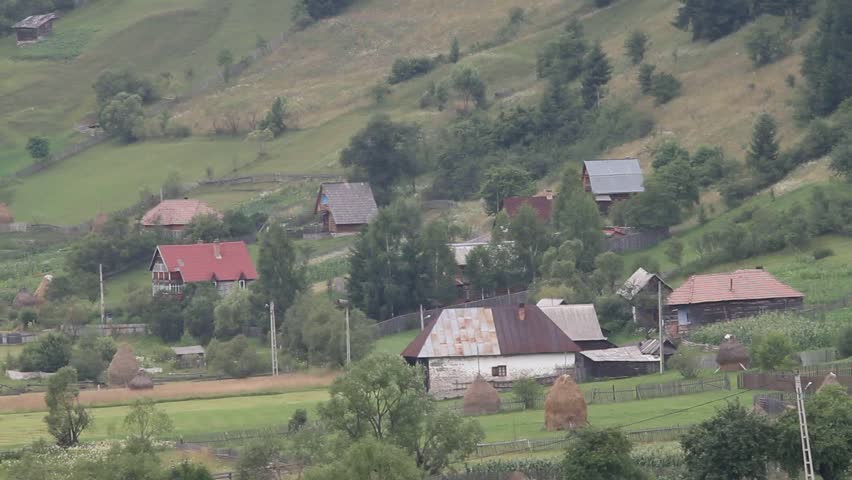 old village houses landscape tele lens old-school transylvania romania hay haymaker pine trees panel fence tiles green yellow red top hamlet wick rare rusty forgetten silence unremembered human beauty