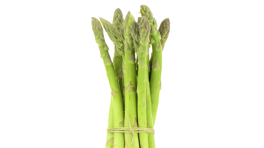 Rotating fresh green asparagus isolated on white background.
