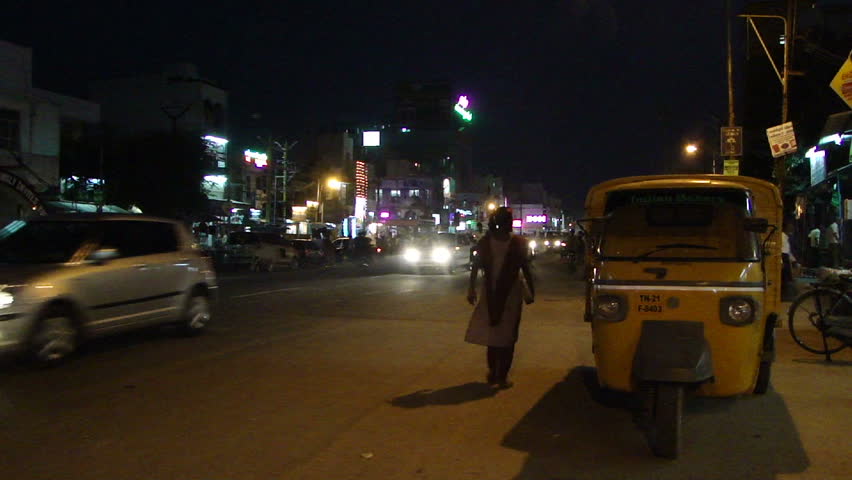 HYDERABAD, INDIA - NOV 22 - 	Night traffic in Hyderabad, India. Pedestrians, motorbicycles and cars share the road on an autumn evening		 on Nov 22, 2009, in Hyderabad, India.
