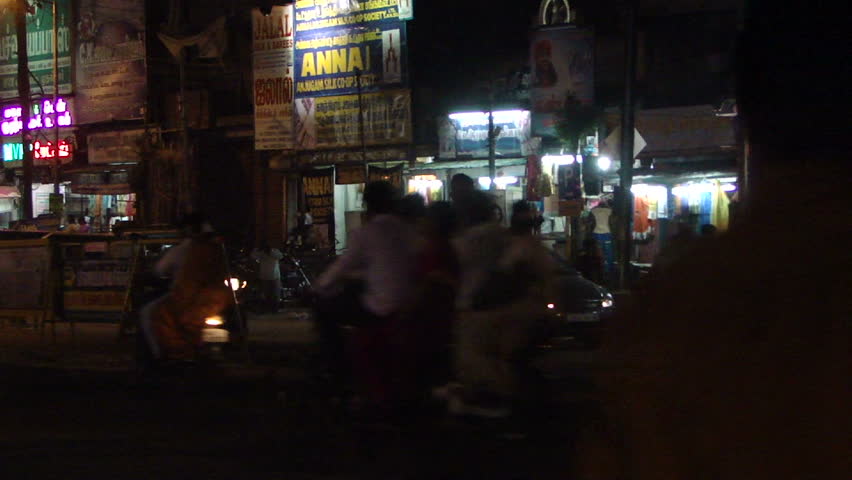 HYDERABAD, INDIA - NOV 22 - 	Night traffic in Hyderabad, India. Pedestrians, motorbicycles and cars share the road on an autumn evening		 on Nov 22, 2009, in Hyderabad, India.
