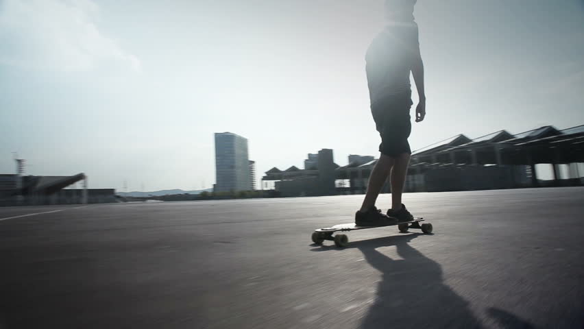 cool guy riding his longboard skate in Barcelona, Spain.
