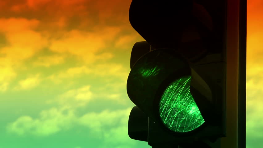 Close up view of green and yellow colors on the traffic light