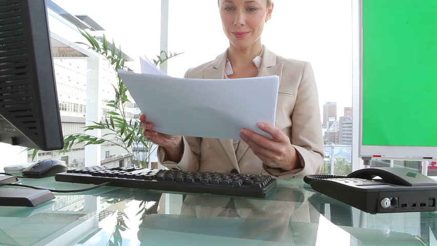Businesswoman reading documents in an office