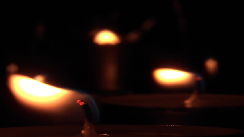 Beautiful candle lights in pitch black night
