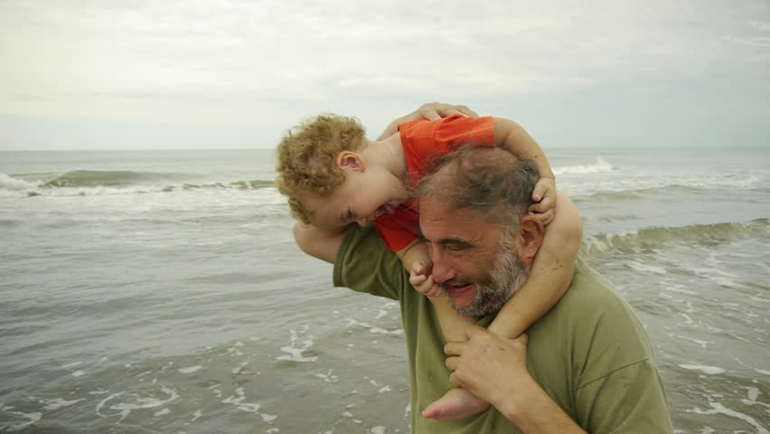 Grandpa & Grandson playing at the beach - Shoulder Ride