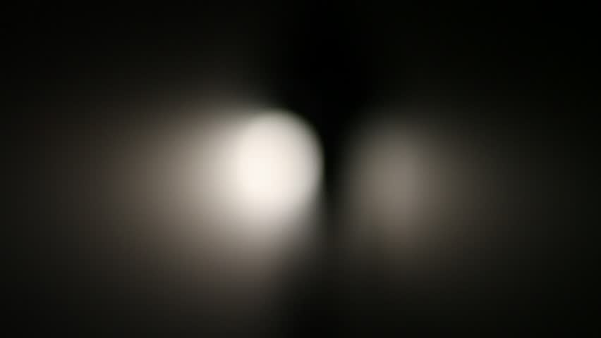 Figure of a man emerges from the light.