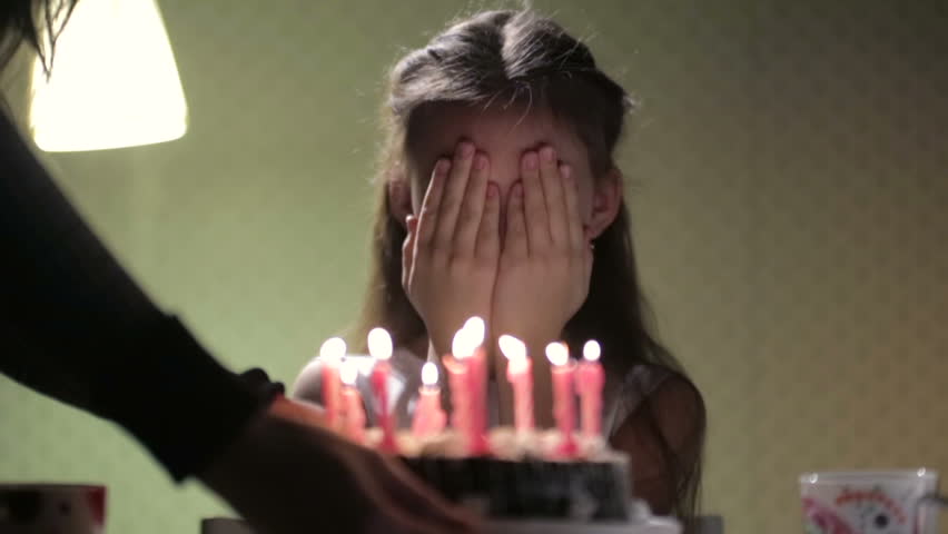 Birthday girl and cake with candles