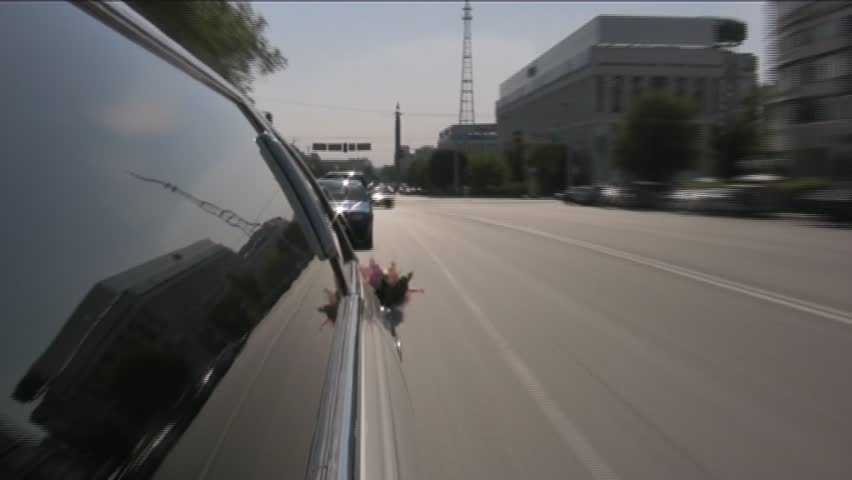 Limo moves through a city