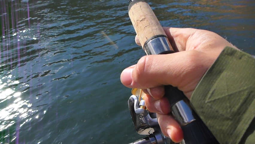 Point of view while casting fishing line out in river.