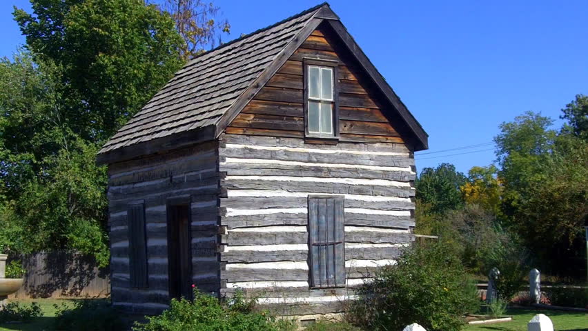 SHAWNEE, OK - OCTOBER 18, 2012: The original restored log cabin (now museum exhibit) the pioneer founder of this mid-American city evokes the frontier days of the USA- circa 2012 in Shawnee.