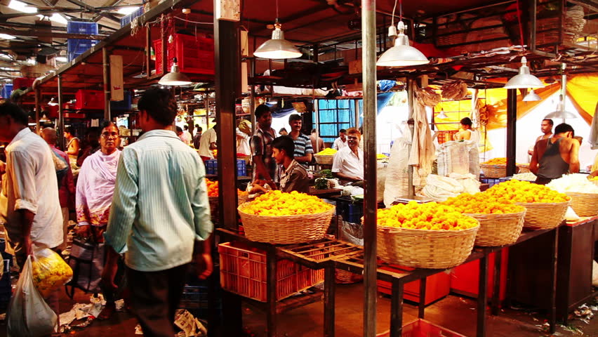 INDIA - JULY 2012: Locked-on shot of a flower market, Dharavi, Mumbai, Maharashtra, India