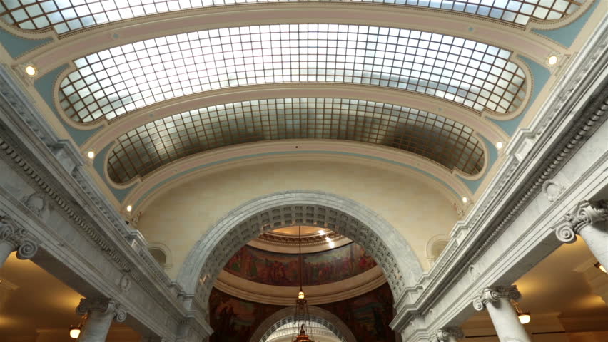 Utah State Capital inside tilt down to rotunda. Capitol building high on a hill overlooking the city of Salt Lake City. Elegant architectural interior design made from granite and copper outer dome. 