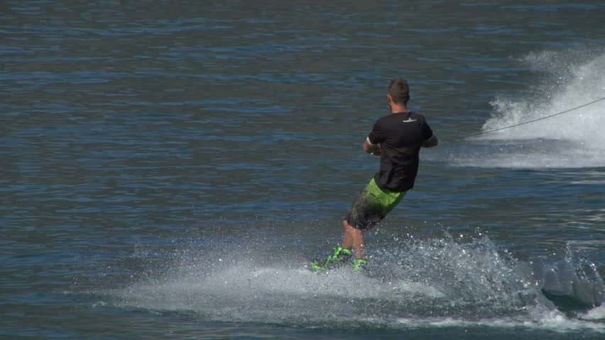 COMO LAKE, ITALY: A young man jumps the wake behind a boat during the "Wakeboard Tour Lario" on 15 september 2012, Como Lake (Italy)