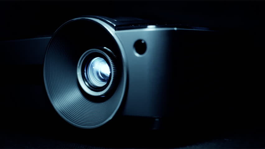 Front view of digital  film projector lens in action