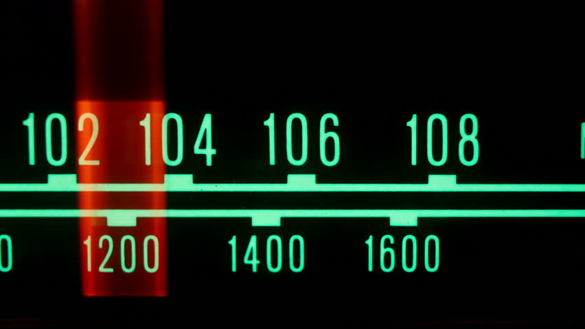 a glowing radio with the marker running through the different stations and frequencies