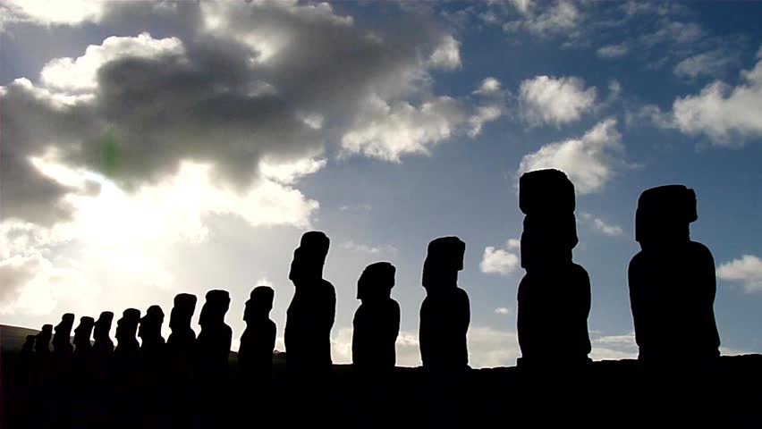 Time lapse of clouds behind the amazing statues (moai) at Ahu Tongariki, Easter Island, Chile. Polynesia.