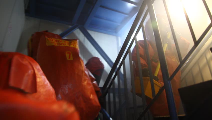 NORTHERN ISRAEL -DECEMBER 17: Firefighters practice to remedy leak accident of corrosive toxic hazardous material Ammonia liquid in seven food factories using protective suites, Northern Israel December 17 2012