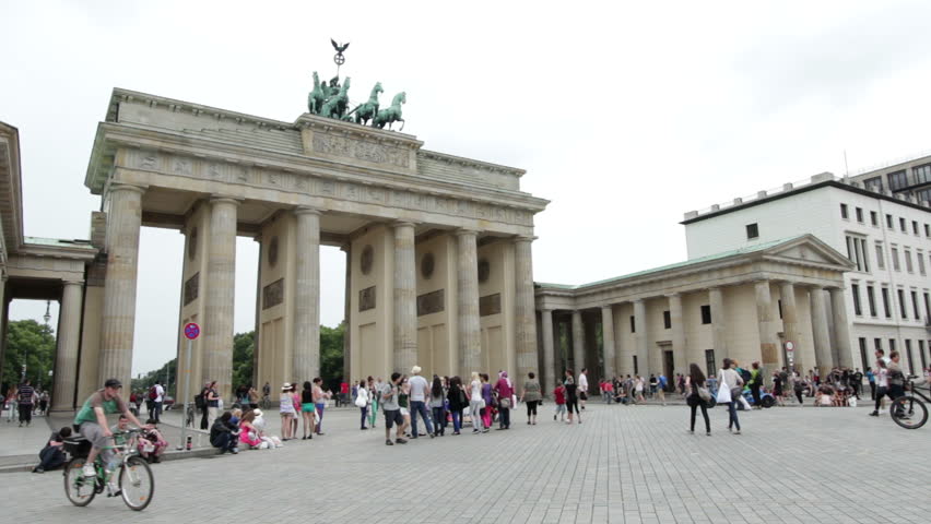BERLIN, GERMANY - JULY 6: Tourists visiting Brandenburg Gate on July 6, 2012 in Berlin, Germany.