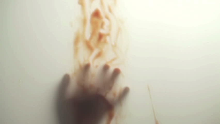 Blood-smeared hand - probably of a crime victim - behind frosted glass
