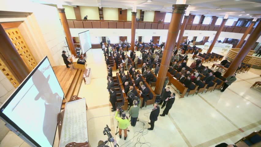 MOSCOW - JAN 27: Journalists and churchgoers in moscow synagogue Beis Menachem listen to Chief Rabbi of Russia Berel Lazar in International Holocaust Remembrance Day, on Jan 27, 2012, Moscow, Russia.