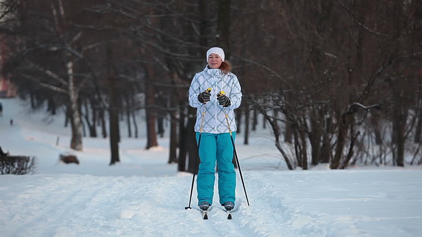 Skiing in city park in cold winter day. Russian woman, Saint-Petersburg, Russia