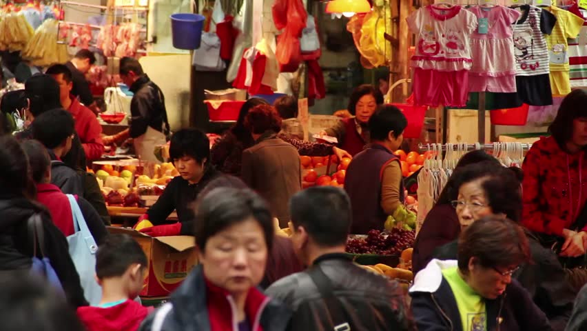 HONG KONG,CHINA - CIRCA AUG 2011 : People shopping for fresh meat and vegetables in the Wet Market, Causeway Bay,Hong Kong, China at night.