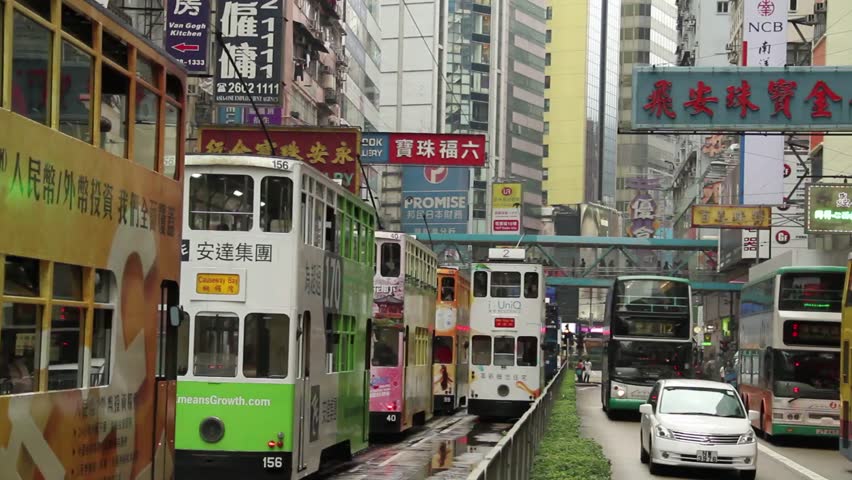 HONG KONG,CHINA :Trams and Buses travelling up and down Causeway Bay, Hong Kong, China. CIRCA 2011. 