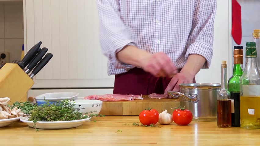 Chef, preparing haricots-verts in raw ham