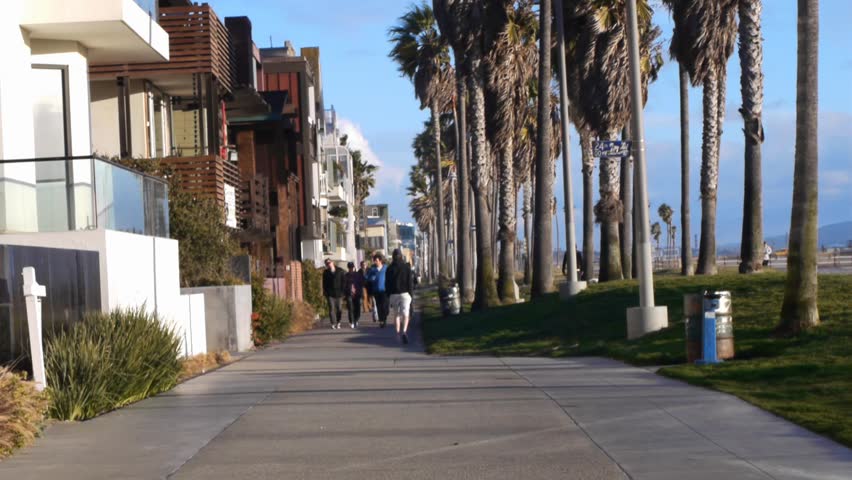 VENICE BEACH, CALIFORNIA - CIRCA 2011:  Tourists and locals walk on the boardwalk at Venice Beach, CA .