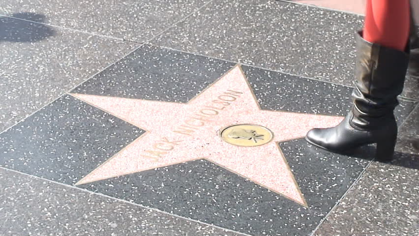 HOLLYWOOD, LOS ANGELES - CIRCA 2009: Tourists walking on Hollywood Walk of Fame in Hollywood, California. 