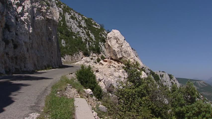 VERDON GORGE, FRANCE: view of gorge, zoom in  - brown goats ruminating on rock