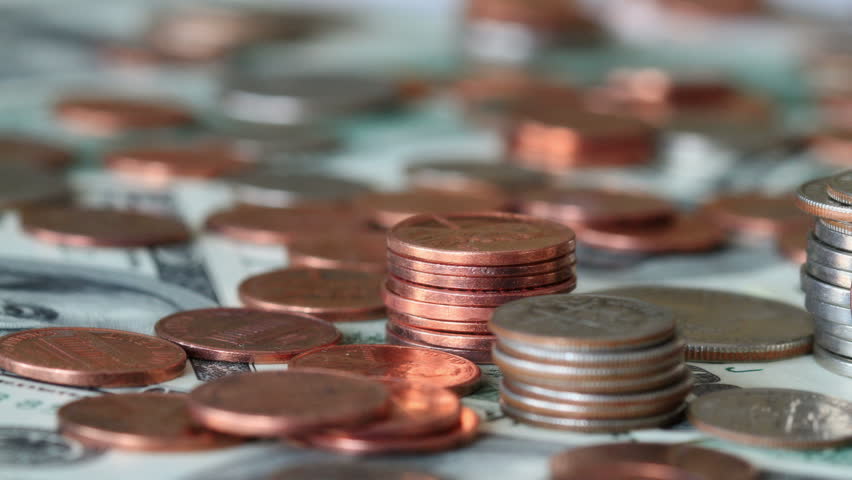 4K. Dollar Bills Shown Together With Loose Coins. Shot Slider.

