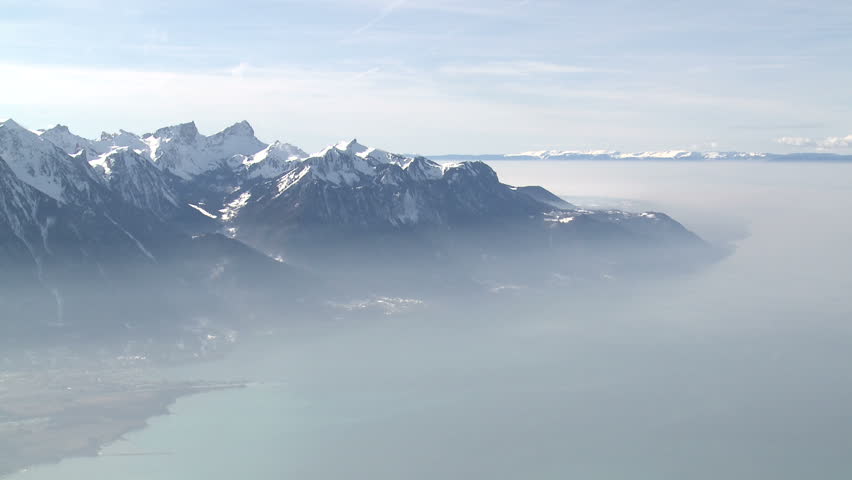 Amazing high altitude view over Lake Geneva in Switzerland shot from about 6,500ft. Includes inversion layer of haze trapped at lower altitude. Shot in full HD 1920x1080 30p on Sony EX1