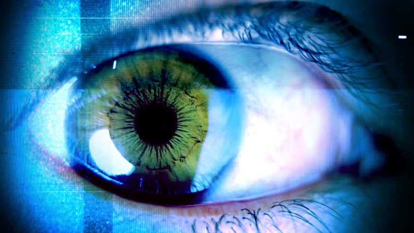 close-up of eye with computer data and text overlayed