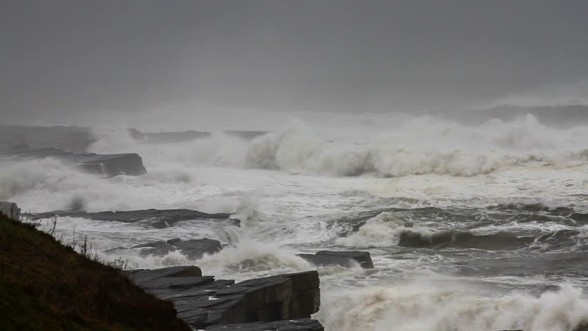 Big storm waves crushing on the cliffs.