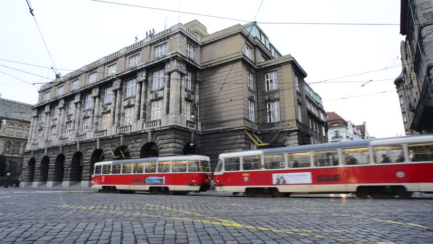 PRAGUE, CZECH REPUBLIC - JAN 6 2013: Early morning traffic in the center of the Prague, Czech Republic. The paving stone crossroad close to the Jan Palach Square.