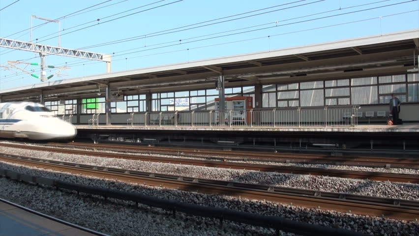 ODAWARA, JAPAN - 16 OCTOBER 2012: A Japanese bullet train arrives at the station of Odawara on its way from Tokyo to Nagoya