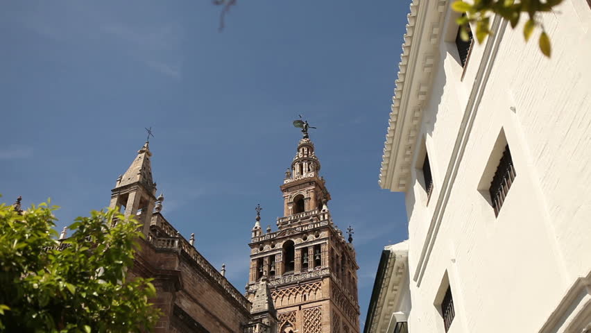 View of the famous Seville mosche with its Giralda minaret in a typical day