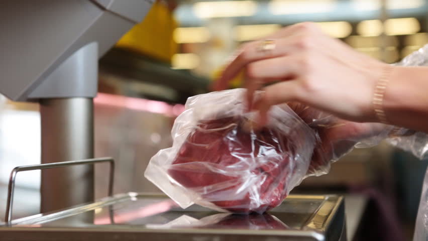 Selling a piece of meat in the store