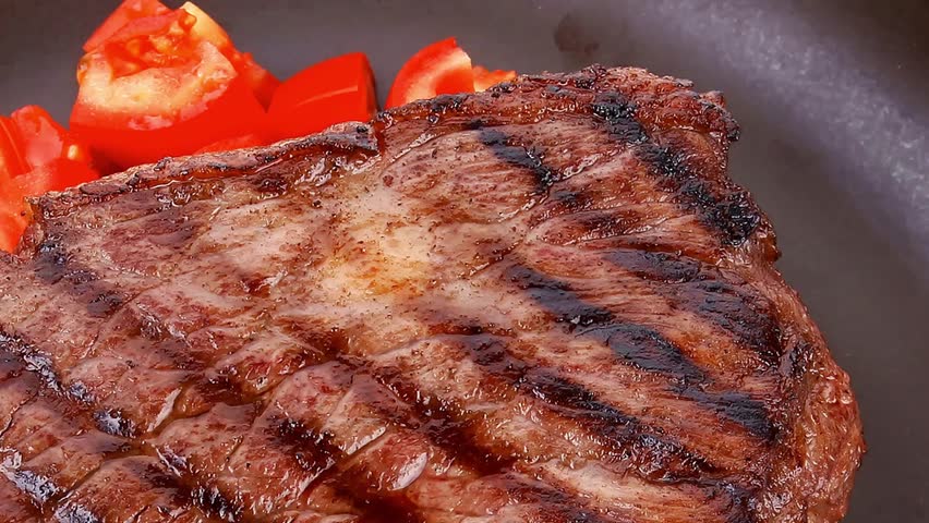 meat table : rare medium roast beef fillet with tomatoes and asparagus served on dish slow motion  hidef