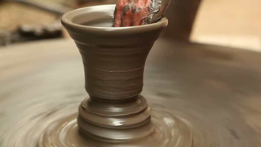 Old potter working in the old traditional way.