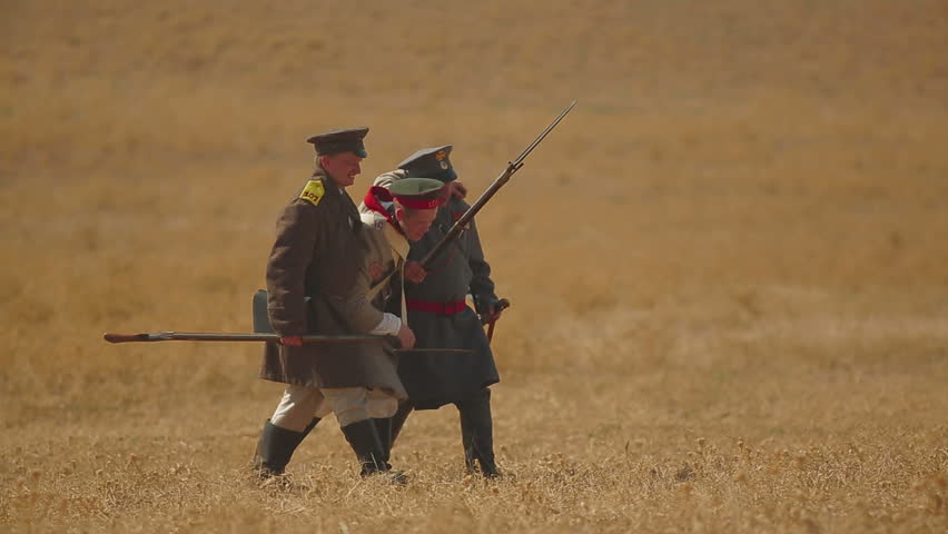 CRIMEA, UKRAINE â SEPTEMBER 29, 2012: Two soldiers help a wounded man during reenactment of Battle of Alma (Crimean War 1853 - 1856) on a historical festival in Crimea. 